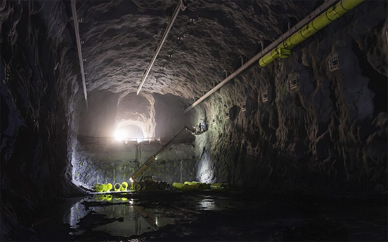 A wide-view photograph of the LBNF caverns with construction equipment