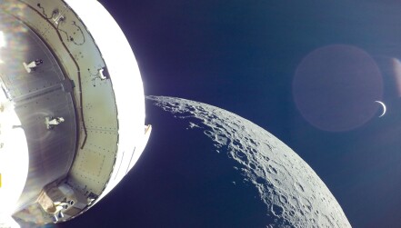 A photo taken by the Orion module of the Earth rising behind the Moon during 2022's Artemis I mission