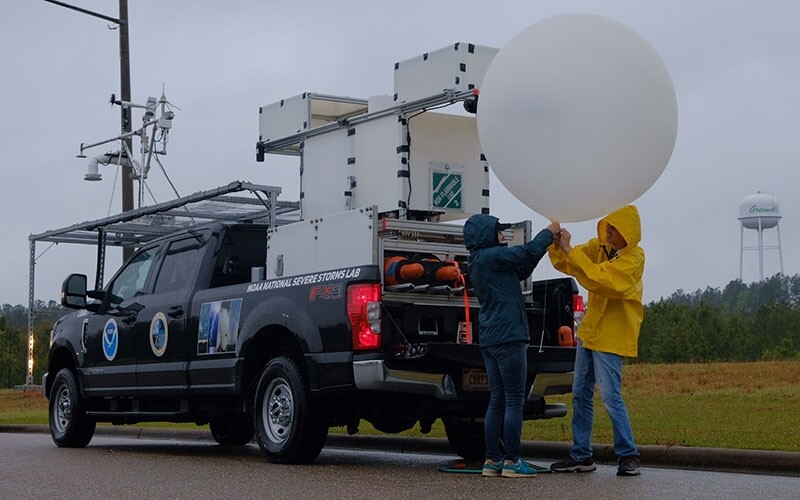 NOAA Weather Research Balloon next to truck