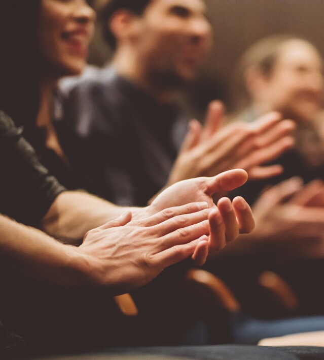 Audience applauding in the theater