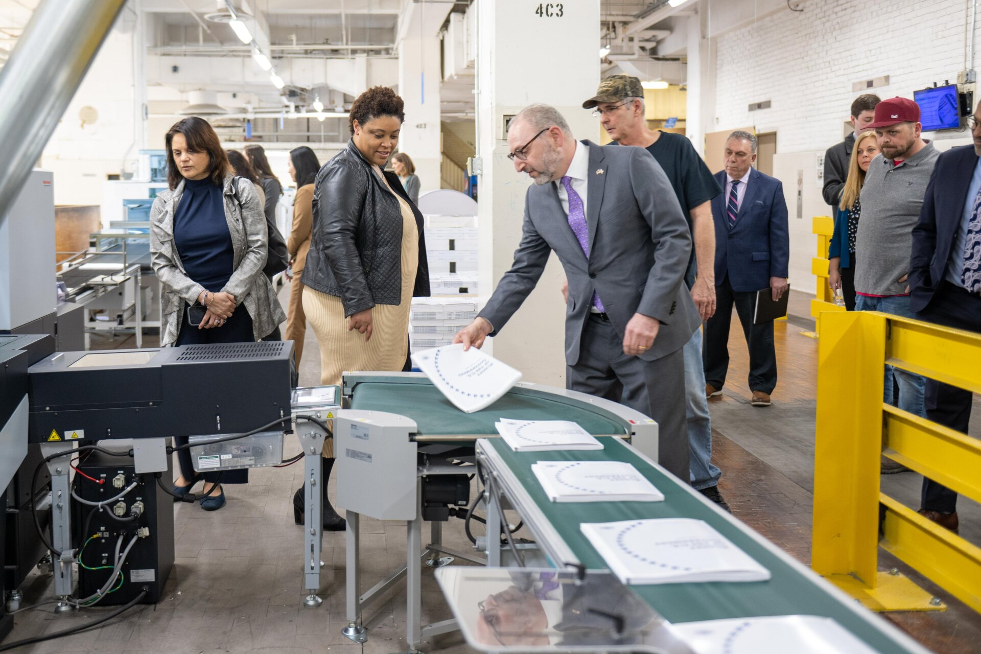 OMB Director Shalanda Young views printed copies of the president's FY2024 budget