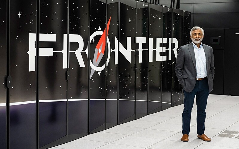 Oak Ridge National Laboratory Director Thomas Zacharia standing next to the lab’s Frontier computer in August 2022