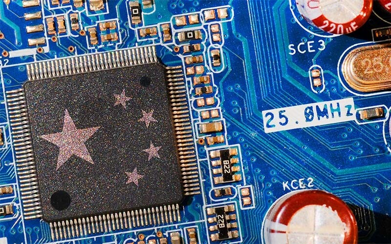 An illustration from a DOD news story showing a Chinese flag overlaid on a circuit board