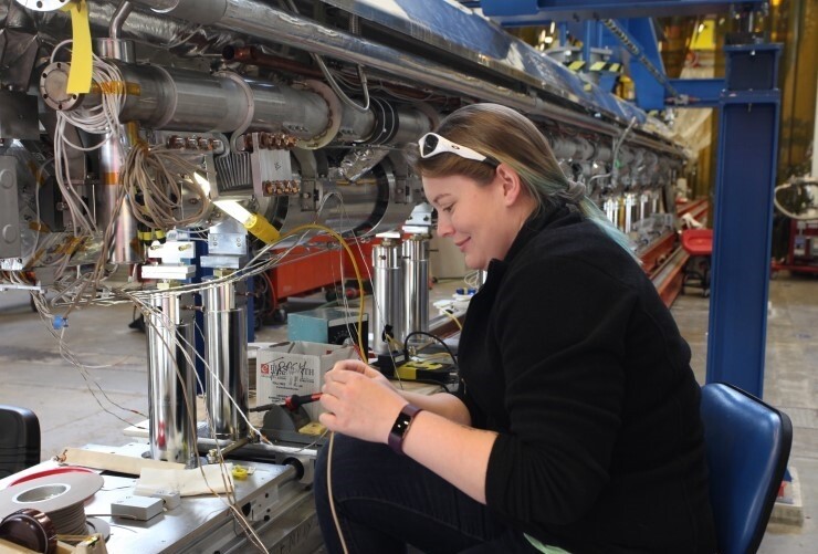 An engineer prepares a cryomodule at Jefferson Lab. 