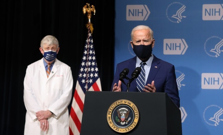 President Joe Biden delivering remarks alongside NIH Director Francis Collins during a visit to the National Institutes of Health in February.