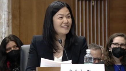 Evelyn Wang, seated and smiling while speaking